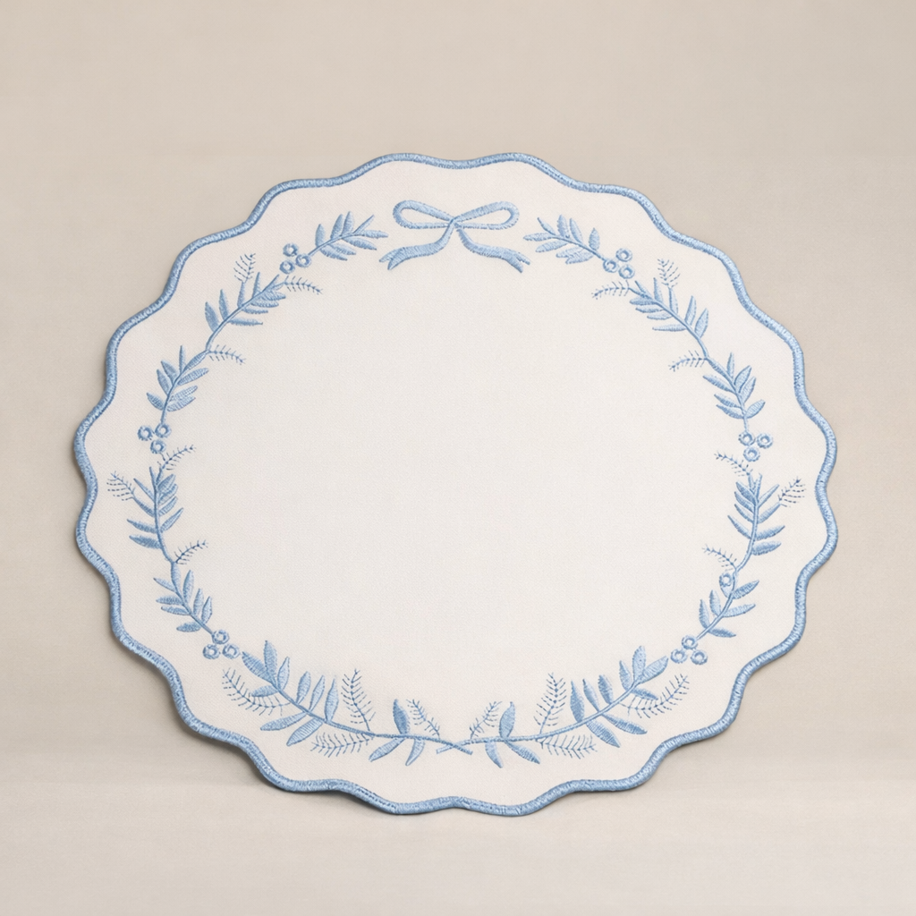 Embroidered Scallop Placemat – White with Blue Bow Wreath 38cm